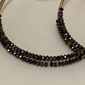 A pair of Chocolate Stones 2 3/4" Triple Hoop Earrings with black crystals on them.