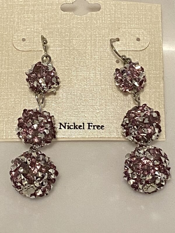 A pair of 2" Pink & Silver 3 Bulb Chandelier Earrings with pink crystals on them.