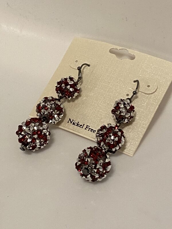 A pair of 2" Pink & Silver 3 Bulb Chandelier Earrings with red and white crystals.