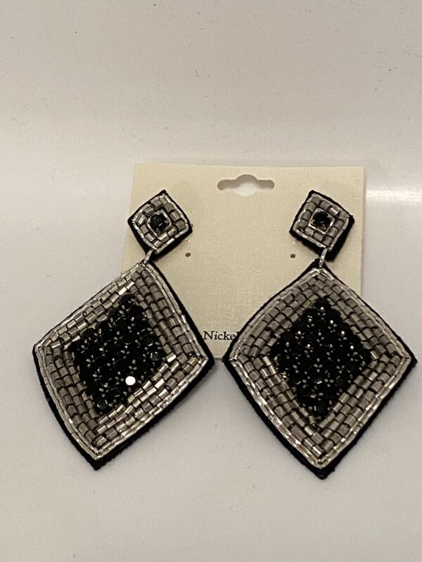 A pair of 3" silver seed bead/black stone diamond shaped chandelier earrings on a white background.