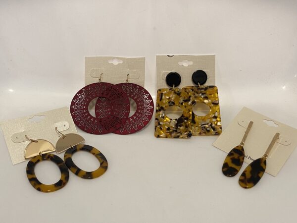 A pair of 23 Christmas In July Animal Print with a Little Burgundy earrings.