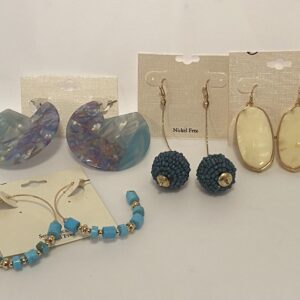 A group of '23 Christmas In July Shades of Blue earrings with blue beads on them.