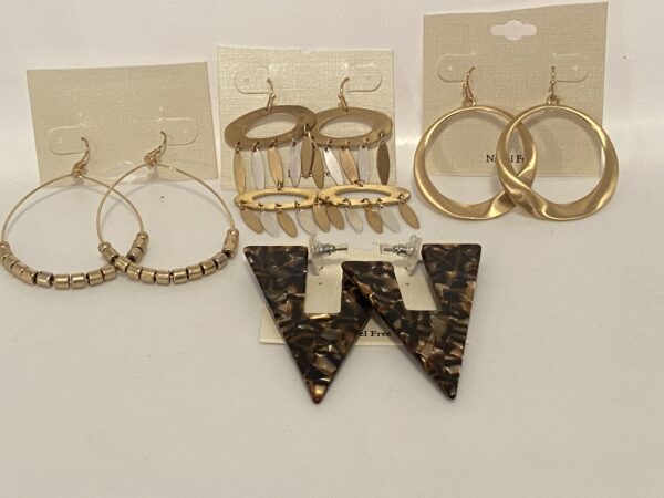 A group of '23 Christmas In July Brushed Gold & Abstract Animal hoop earrings on a white background.