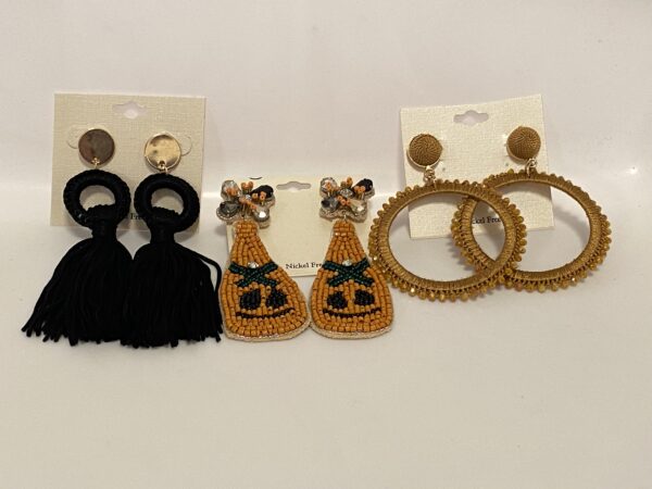 Three pairs of earrings with 23 Christmas In July Halloween Glamour and 23 Christmas In July Halloween Glamour.