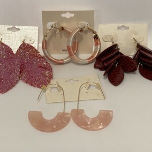 A group of '23 Christmas In July Pink & Burgundy Set earrings with different colors and designs.